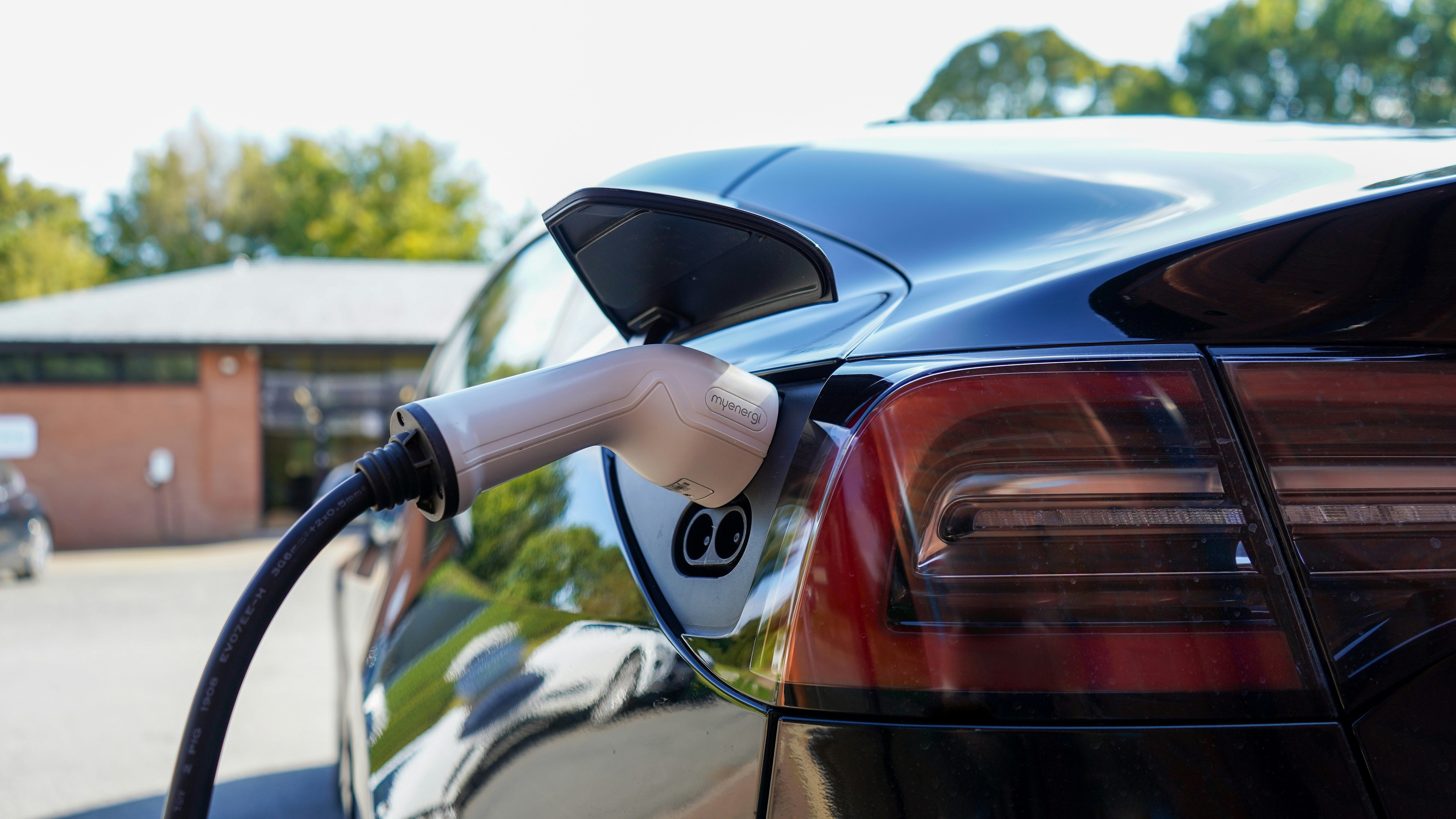 Modern EV charger installation in a residential garage by Humble Power Solutions